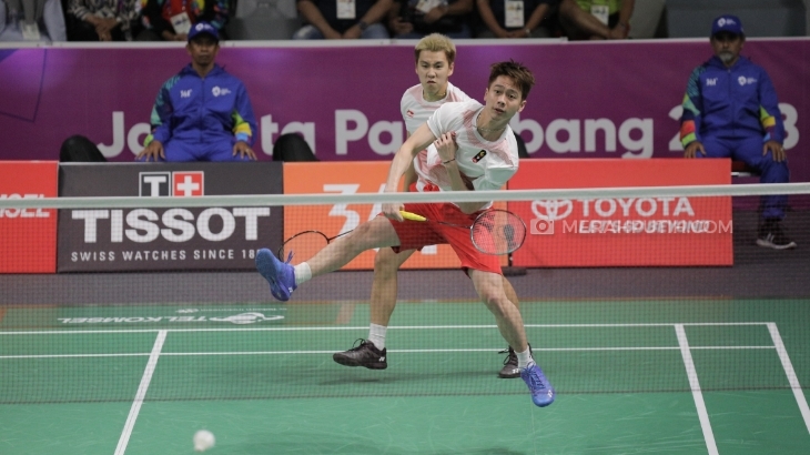 Aksi Marcus Fernaldi Gideon/Kevin Sanjaya Sukamuljo di Asian Games 2018. (Foto: MP/Rizki Fitrianto)