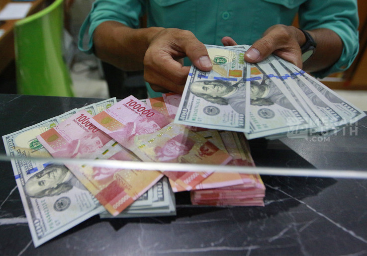 Penutupan Rupiah Akhir Pekan Diprediksi Anjlok Dipicu Pidato Hawkish The Fed