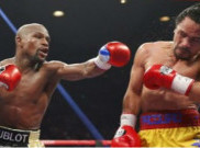 Floyd Mayweather Jr Tumbangkan Manny Pacquiao di MGM Grand Arena