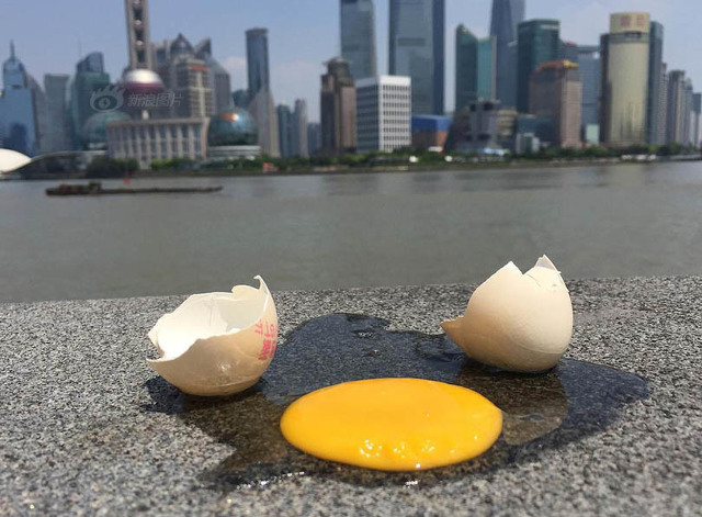 Suhu Panas Tinggi, Warga Shanghai Bisa Goreng Telur di Trotoar