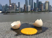 Suhu Panas Tinggi, Warga Shanghai Bisa Goreng Telur di Trotoar
