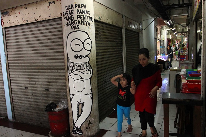 Mural soal ekonomi rakyat di Pasar Tebet Timur, Jakarta Selatan. (Foto: MerahPutih/Dery Ridwansah)