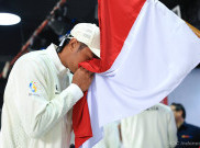 Atlet Voli Pantai Indonesia Bintang Akbar Bawa Bendera Merah Putih di Pembukaan Asian Beach Games Sanya 2026