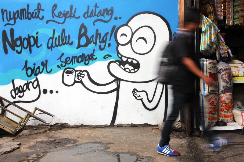 Mural soal ekonomi rakyat di Pasar Tebet Timur, Jakarta Selatan. (Foto: MerahPutih/Dery Ridwansah)