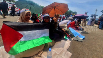 Aksi Solidaritas untuk Rakyat Palestina di Patung Kuda Monas Jakarta